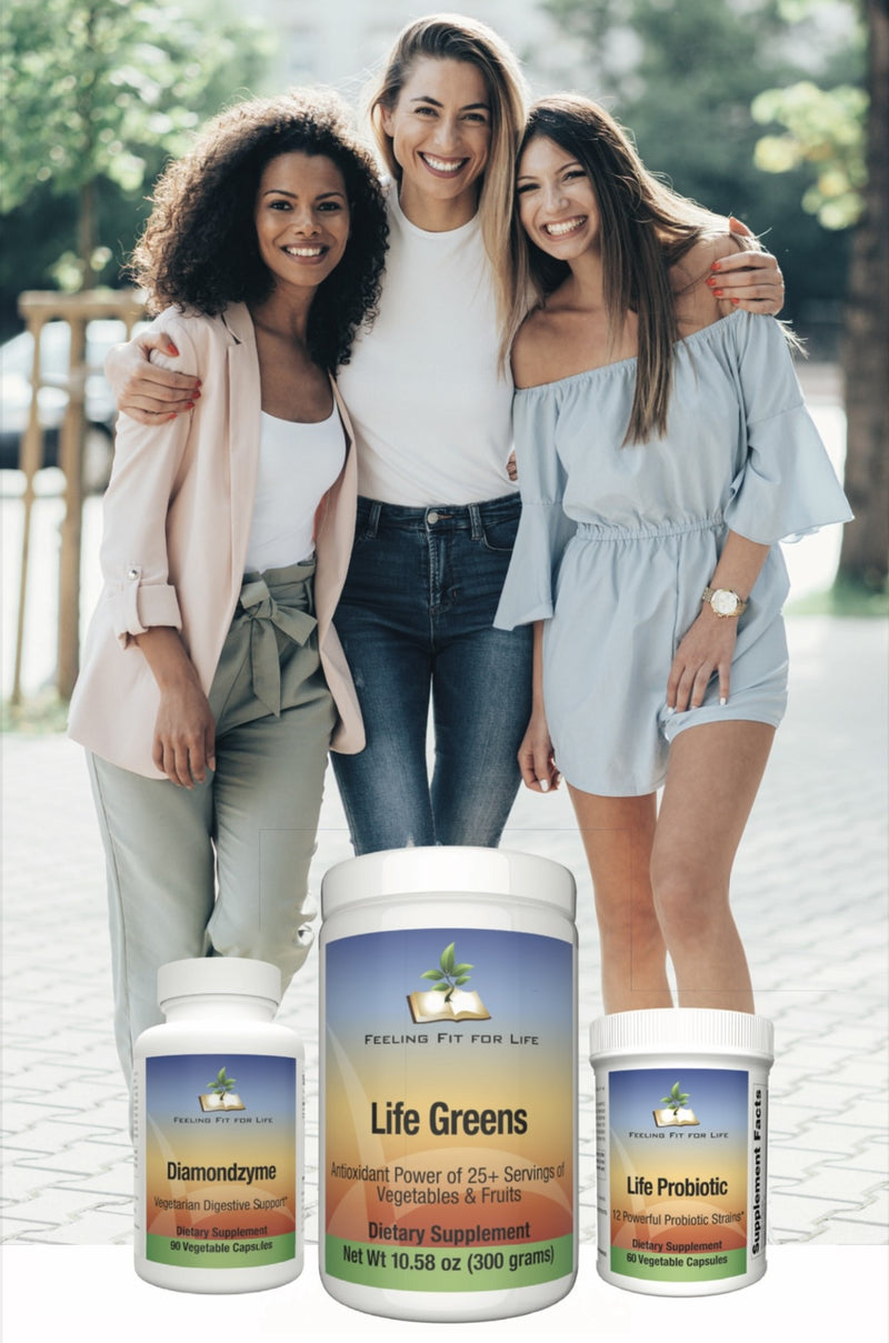 A group of women posing for a picture with a bottle of vitamins, and a white bottle with a label. Fit For Life Trio: DiamondZyme, Life Greens, and Life Probiotic.